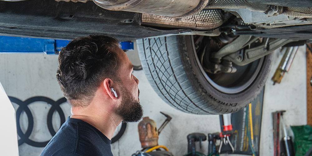 Image Of Mechanic Fixing The Brake